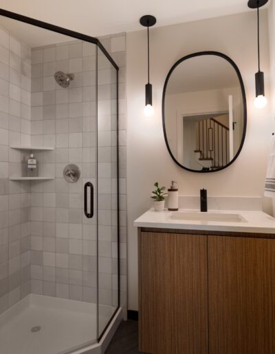 A modern bathroom with a glass shower stall.