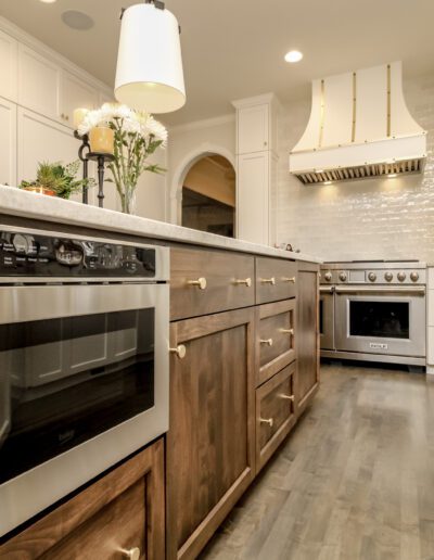 A kitchen with white cabinets and stainless steel appliances.