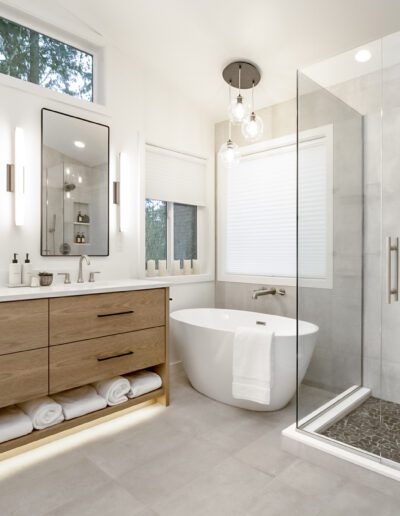 A modern bathroom with a walk in shower.