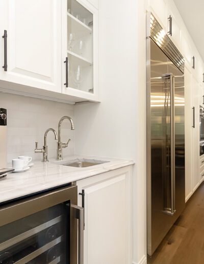 A kitchen with stainless steel appliances and a coffee maker.